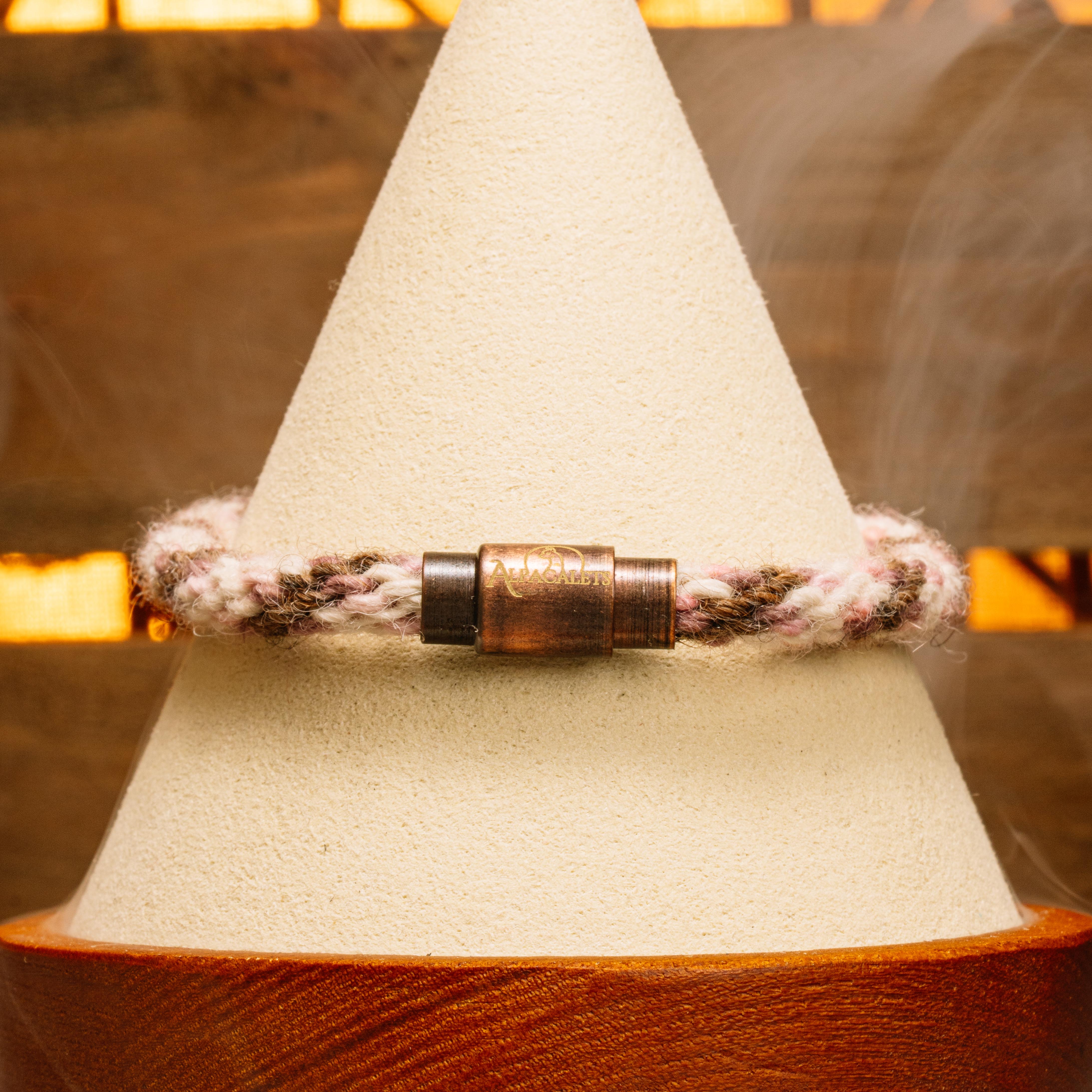 Bronze Blush alpaca bracelet featuring soft rose, cream tones, and a bronze clasp, made in America.